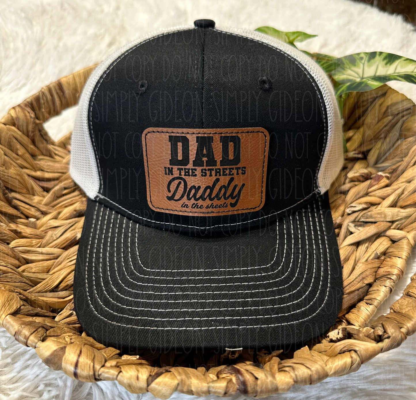 Black and white with a brown laser engraved patch that reads Dad in the streets daddy in the streets